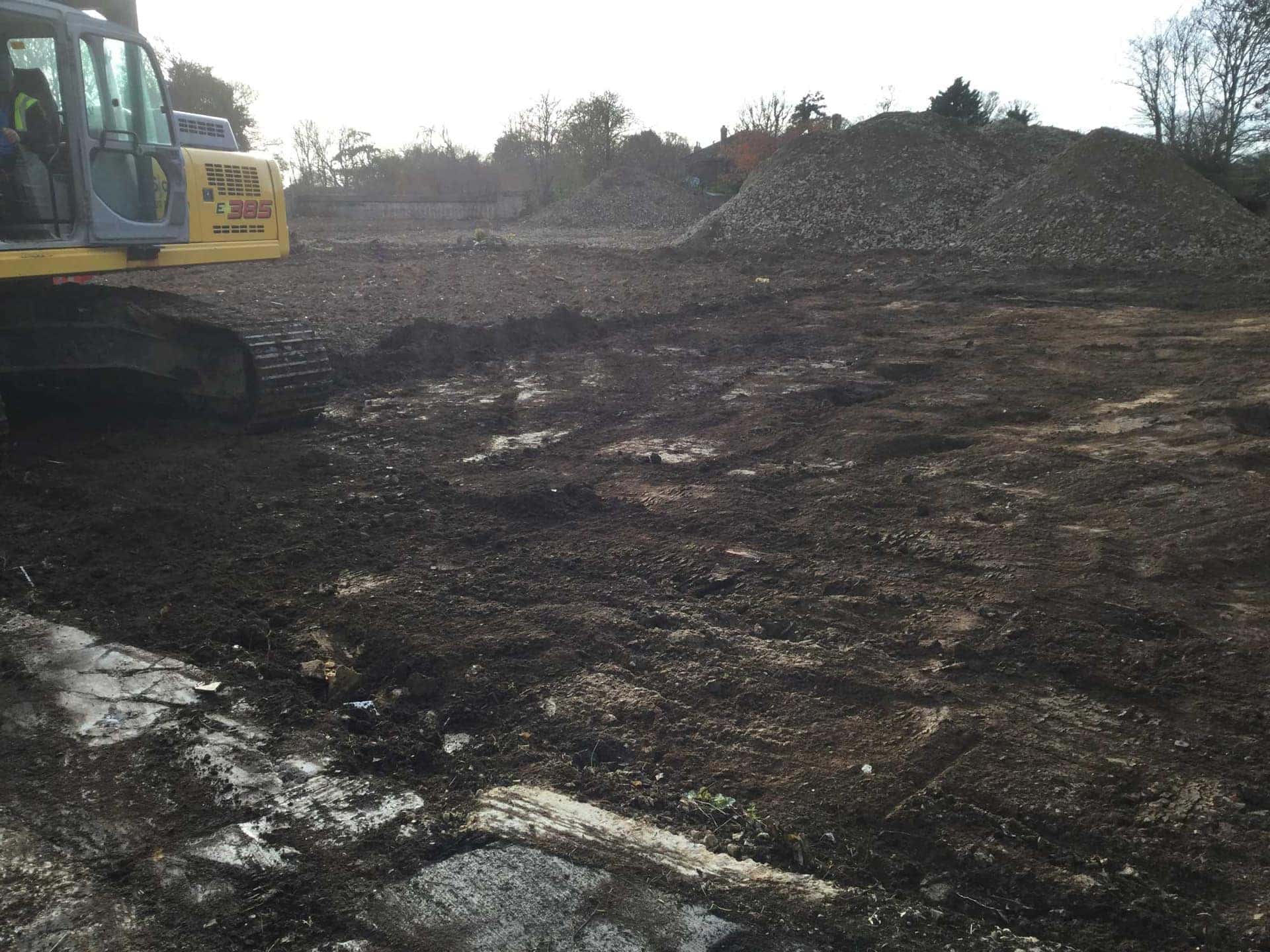 Warning signage on a hoarding reading land remediation in progress