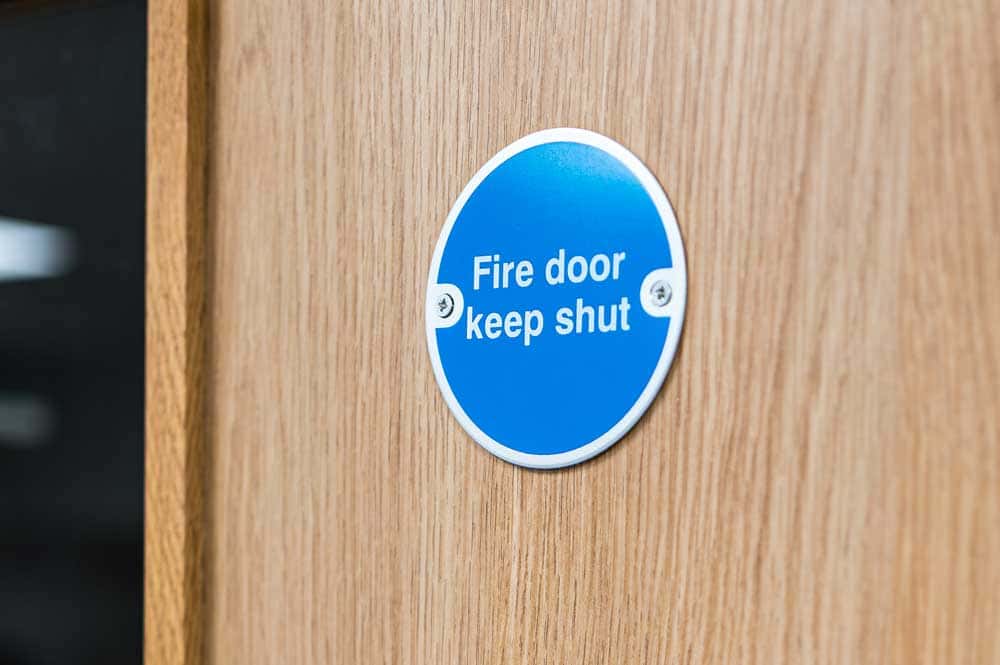 Fire door closer and intumescent seal on a completed installation