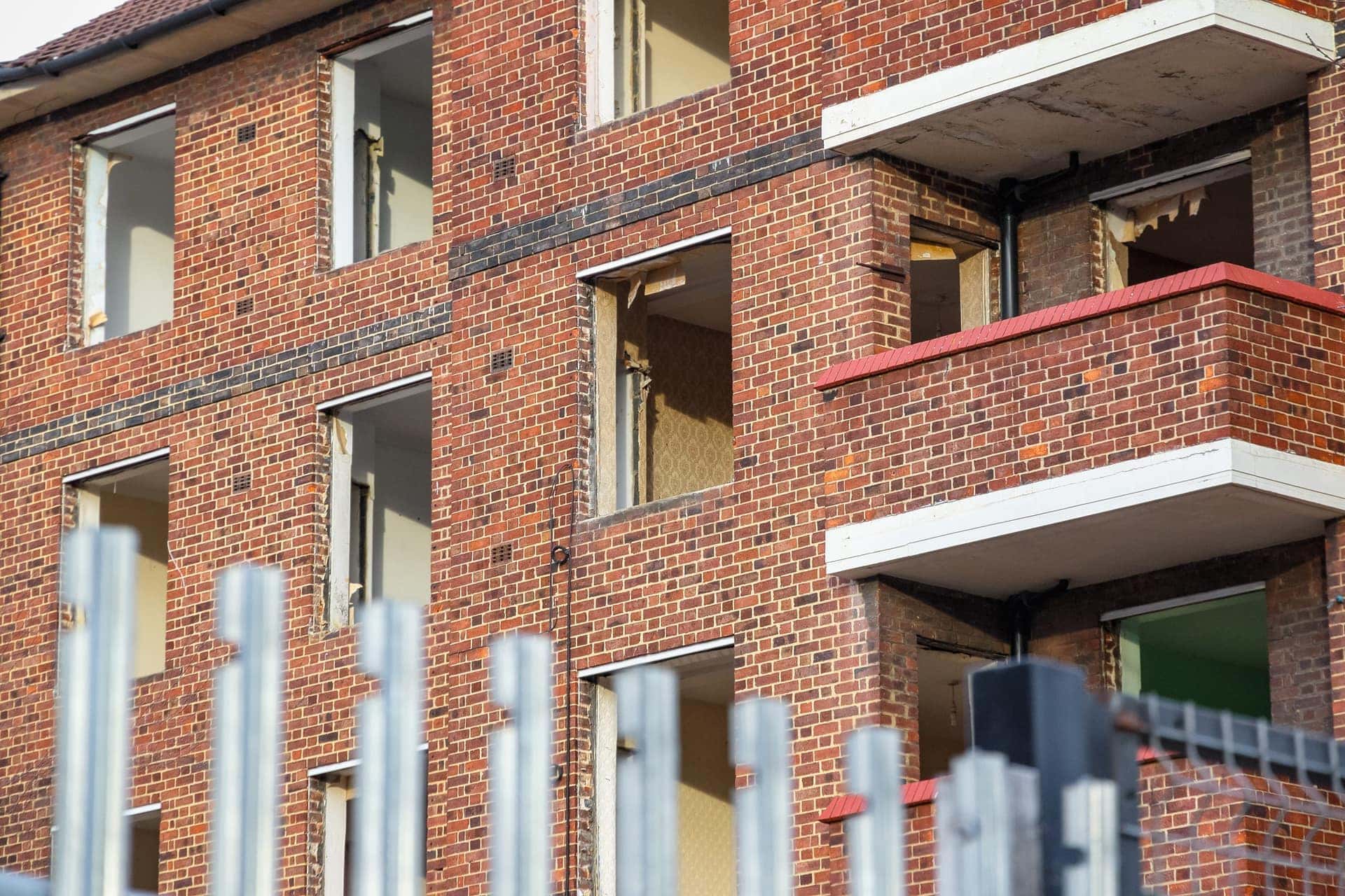 Stripped residential block with windows removed ahead of refurbishment